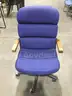 Blue adjustable chair; brown hardwood armrests  “DH”