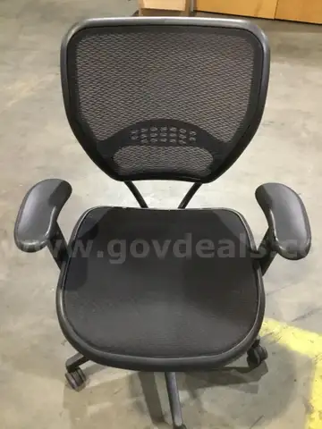 Black mesh adjustable office chair; black padded armrests  “DH”