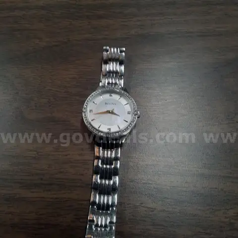 One Bulova Watch                  "JM"