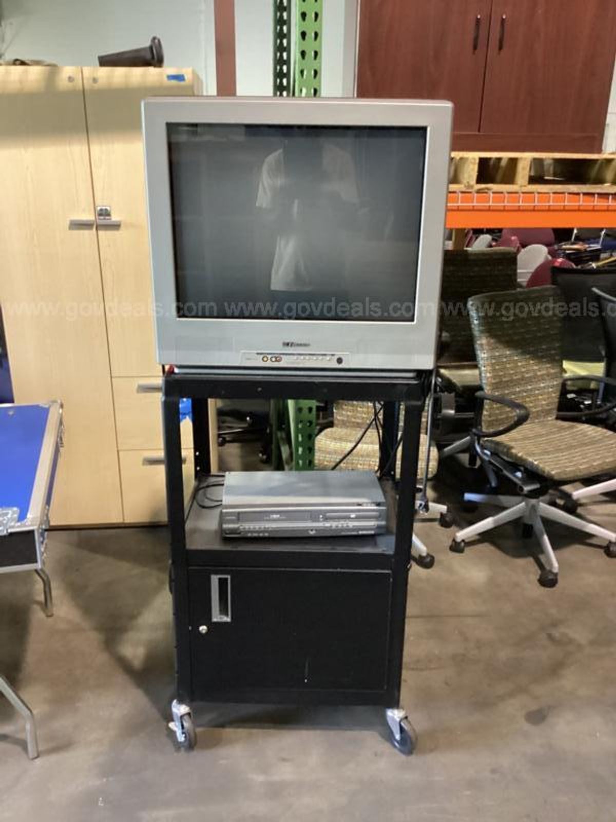 Emerson T.V. with stand and a VHS and DVD player GovDeals