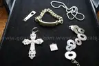 BRACELET (2); NECKLACE WITH CROSS (1); CHARMS (2)