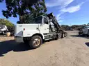 2000 Volvo WG  T/A Roll Off Truck