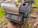 Hot water pressure and steam washing machine