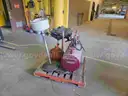 Pallet of various oil change and shop equipment.