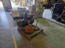 Pallet of various oil change and shop equipment.