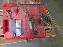 Pallet of used automatic transmission parts, automotive electrical components, and automotive ignition system trainer.