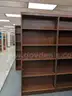 Walnut shelving w/ hardware used in library setting
