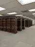 Walnut shelving w/ hardware used in library setting