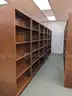 Walnut shelving w/ hardware used in library setting