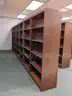 Walnut shelving w/ hardware used in library setting