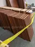 Walnut shelving w/ hardware used in library setting