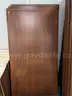 Walnut shelving w/ hardware used in library setting
