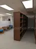 Walnut shelving w/ hardware used in library setting