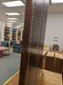 Walnut shelving w/ hardware used in library setting