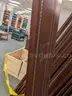 Walnut shelving w/ hardware used in library setting