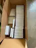 25 Boxes of white DVD cases