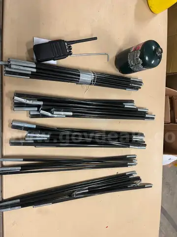 Tent poles and a radio