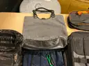 Lot of backpacks and large bags