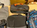 Lot of backpacks and large bags