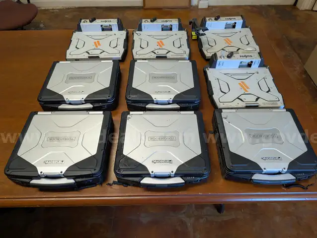 Lot of (5) Panasonic Toughbook CF-31 and (4) Havis docking stations