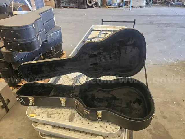 31 Guitar Hard Cases &#x2013; 14 w/ Acoustic Guitars, 17 Empty