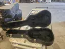 31 Guitar Hard Cases &#x2013; 14 w/ Acoustic Guitars, 17 Empty