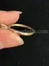 RING GOLD IN COLOR WITH MARQUIS CLEAR STONE, 3 SMALL STONES ON EITHER SIDE; MARKED 14K