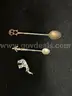THREE MISC ITEMS: (2) SMALL DECORATIVE SPOONS, SILVER AND BRASS IN COLOR; (1) MINITURE ELEPHANT, SILVER IN COLOR