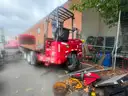 2014 Volvo VHD Tri/A Flatbed Truck w/ 2015 Moffett M8 55.4P Truck Mounted Forklift