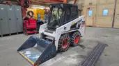 2011 Bobcat S100 skid steer. Runs and drives well, low hours. Includes bucket, chains, and backup camera.