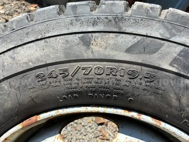 Brand new 245/70R19.5 Tire on rim from GMC