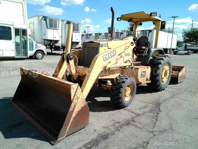 2002 JOHN DEERE 210LE