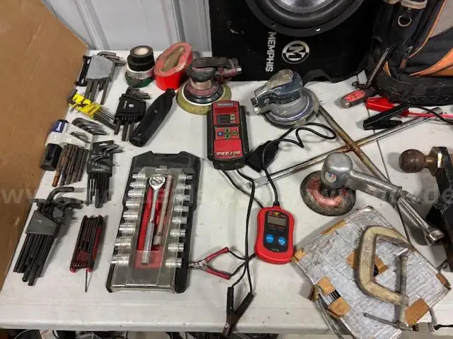 Assorted tools and engine parts
