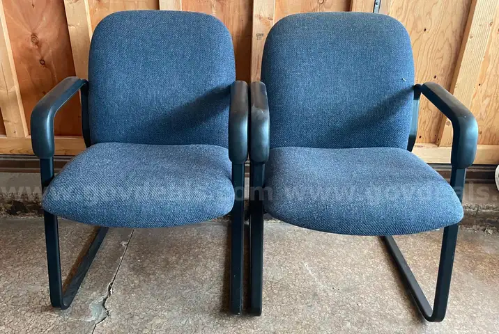 2 blue office chairs
