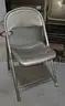 Lot of (250) metal folding chairs with three (3) rolling racks