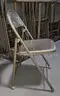 Lot of (250) metal folding chairs with three (3) rolling racks