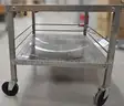 LOT of Two (2) Stainless Steel tables on wheels