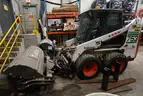 Bobcat 753 Skid Steer Loader with broom, scoop, and brush cat attachments