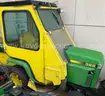 John Deere 322 Lawn Tractor with enclosed cab, trailer and 2 plow attachments