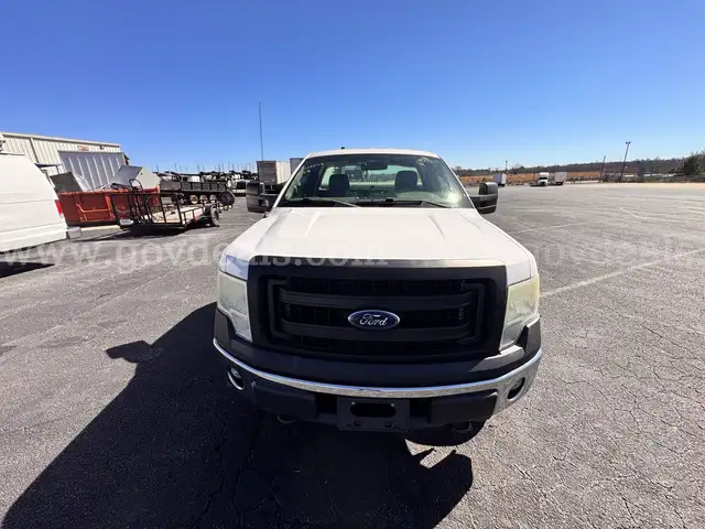 2014 Ford F-150 4x4 with 5.0L V8. Solid work truck equipped with bed-mounted manual crane/hoist and toolbox.