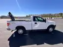 2014 Ford F-150 4x4 with 5.0L V8. Solid work truck equipped with bed-mounted manual crane/hoist and toolbox.