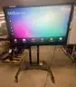 Aver 65 inch Interactive Flat Panel Board on a wheeled stand. Android OS. Factory reset and in good condition.