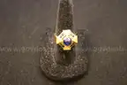 Gold colored ring with  multiple colored stones and multiple clear stones