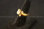 Gold colored ring with multiple clear stones