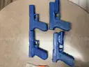 Blank training rounds, Glock 21 magazines, and blue molded Glock G21 guns