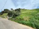 Vacant land in San Fernando with existing house foundations and address.