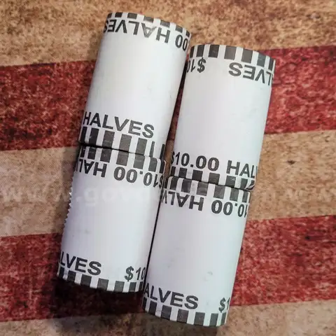 4 Rolls of Kennedy Half Dollars Unopened