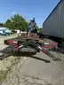Heavy duty trailer with hydraulic arm
