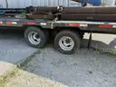 Heavy duty trailer with hydraulic arm