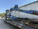 Heavy duty trailer with hydraulic arm